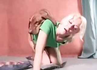 Blondie in green seducing a hot mutt